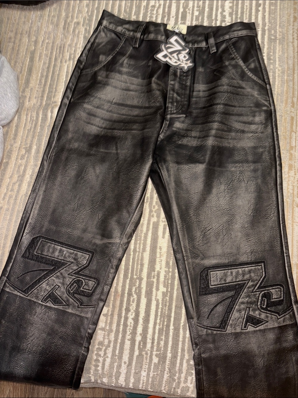 Men's Black Faux Leather Pants with Embossed Knee Graphics